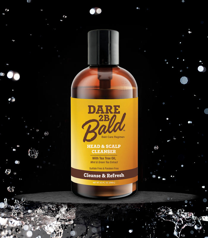 Dare 2B Bald head and scalp cleanser bottle with yellow label on a black background