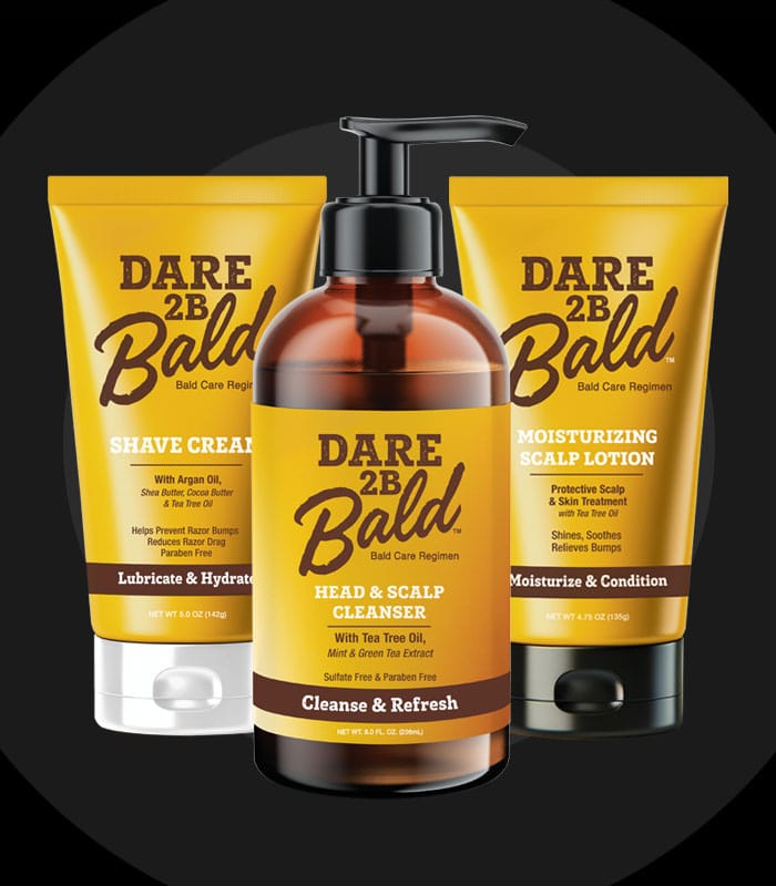 Dare 2B Bald hair care products including shave cream, cleanser, and lotion on a black background
