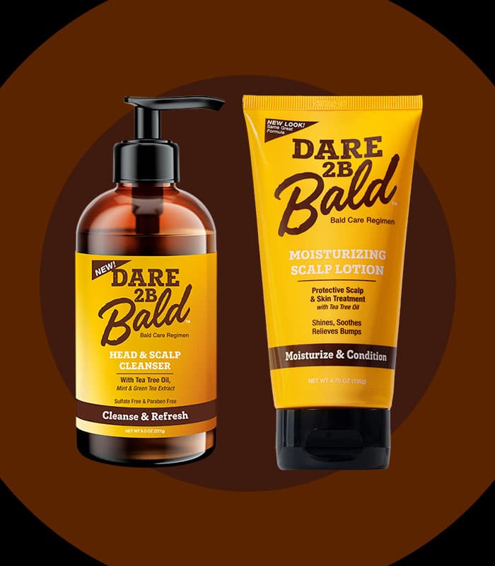 Dare 2B Bald Head & Scalp Cleanser and Moisturizing Scalp Lotion on a brown background