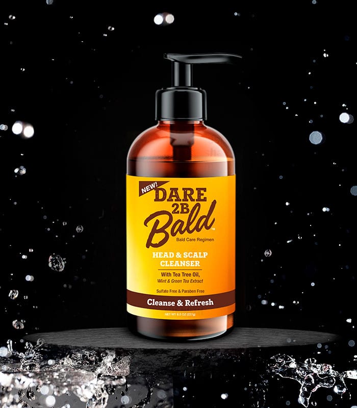 Dare 2B Bald head and scalp cleanser bottle with yellow label on a black background