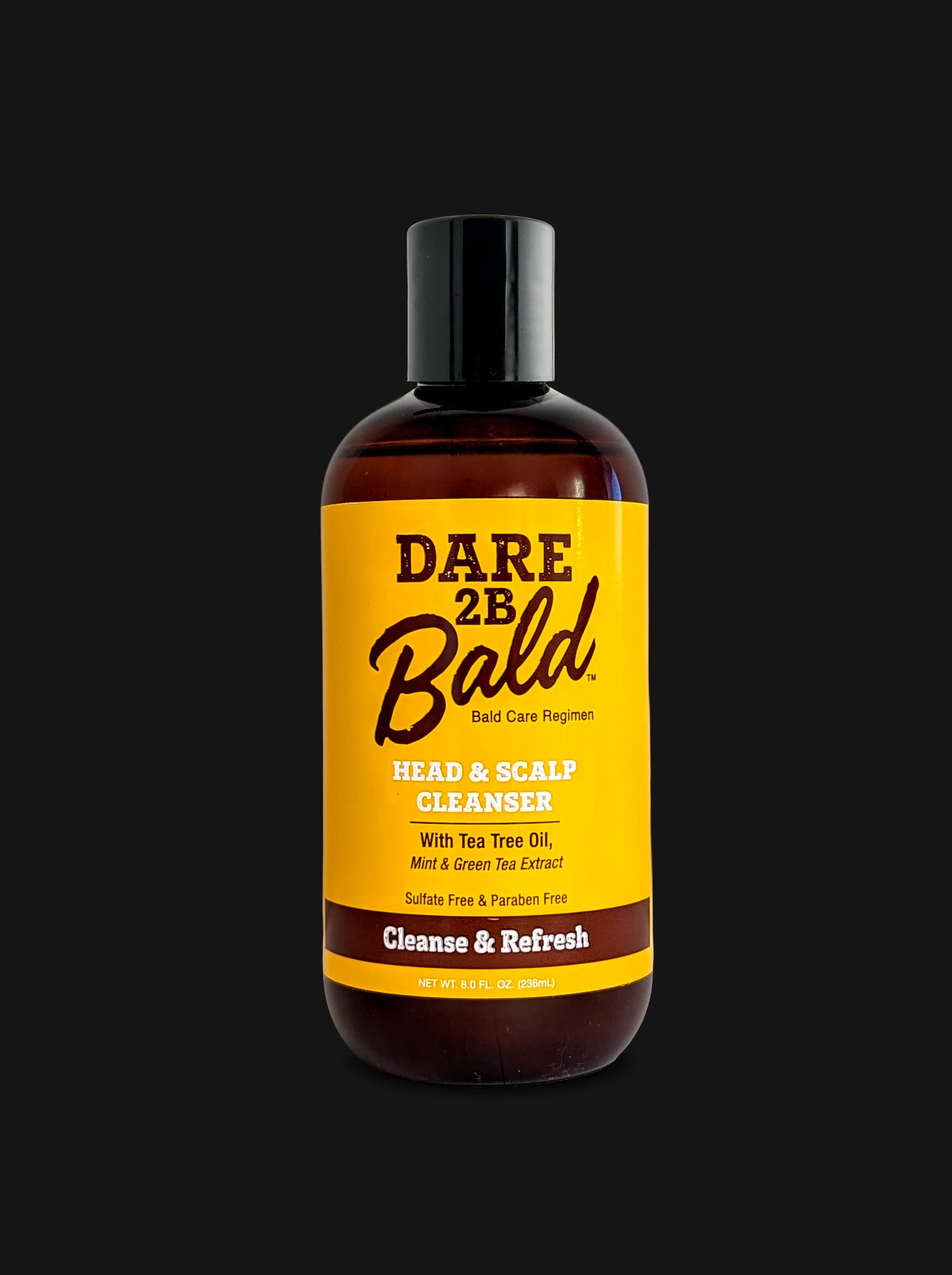 A bottle of Dare 2B Bald Head & Scalp Cleanser with a black cap and a bright yellow label, set against a solid black background.