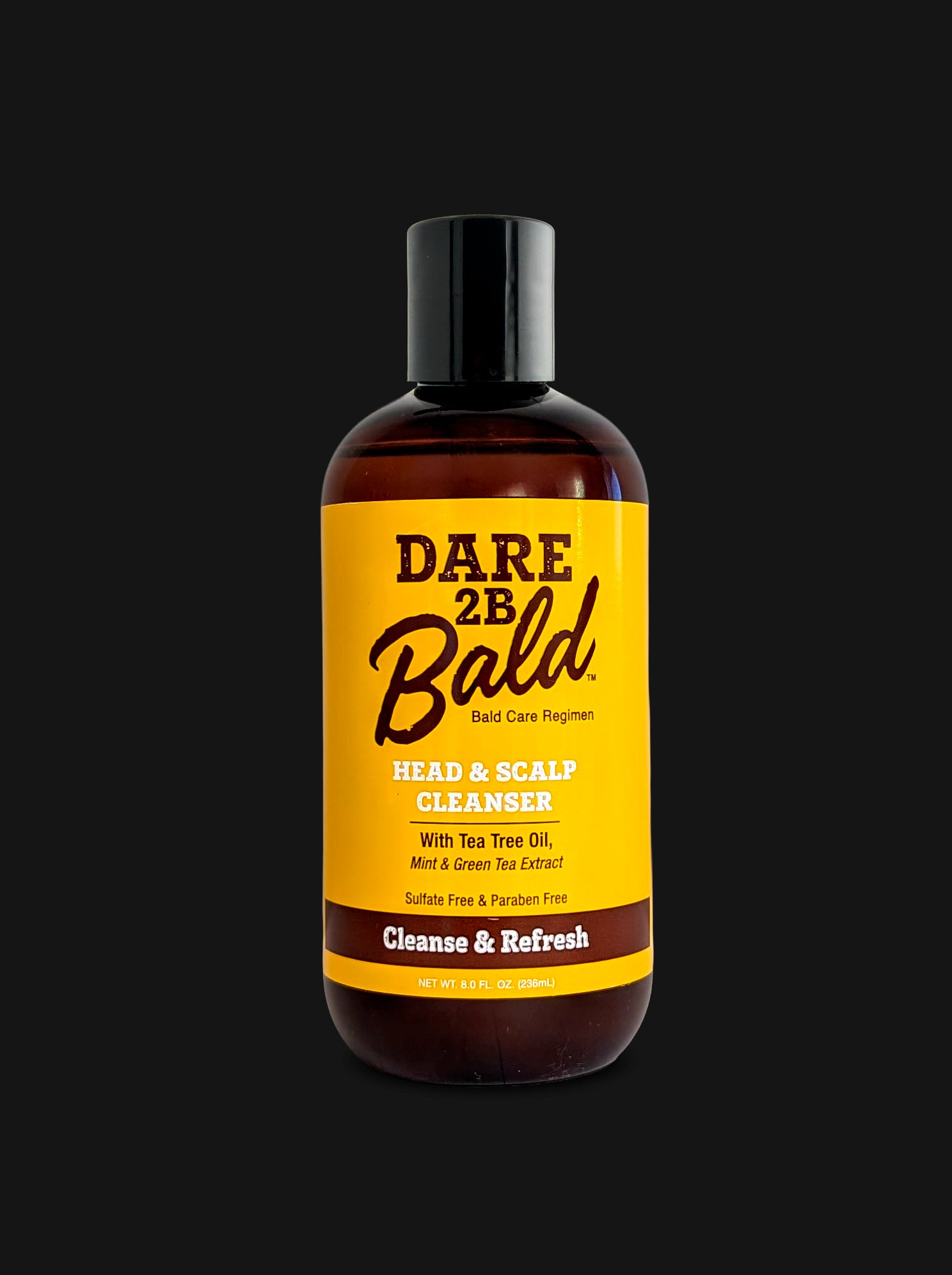 A bottle of Dare 2B Bald Head & Scalp Cleanser with a black cap and a bright yellow label, set against a solid black background.